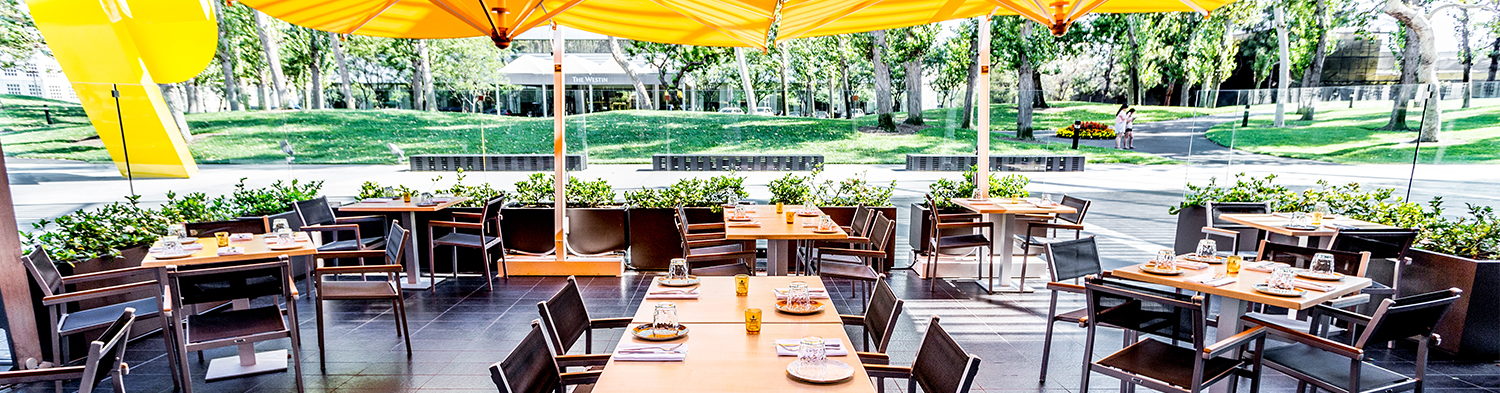 Summer shade. Outdoor dining is - South Coast Plaza